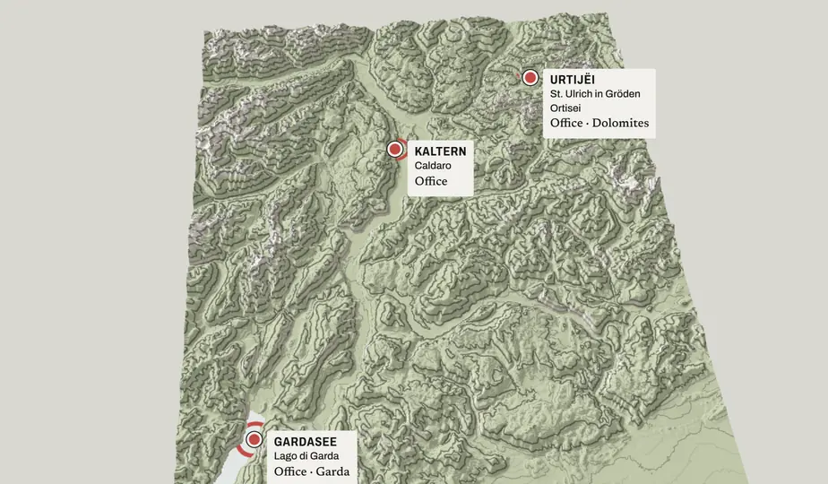 Still: a high view of the whole region, with the three offices marked: Dolomites, Kaltern / Caldaro, Garda.